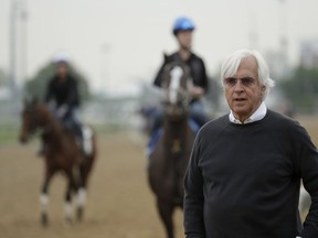Trainer Bob Baffert, who has three Kentucky Derby hopefuls, watches on the track during a workout at Churchill Downs Tuesday, April 30, 2019, in Louisville, Ky. The 145th running of the Kentucky Derby is scheduled for Saturday, May 4.