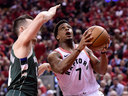 Toronto Raptors guard Kyle Lowry drives for the basket against Milwaukee Bucks guard Pat Connaughton during Game 4 of the NBA Eastern Conference final in Toronto on May 21, 2019.