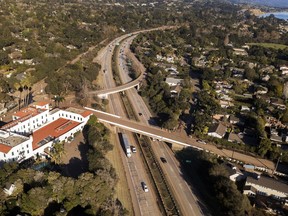 FILE - This Jan. 22, 2018 file photo from a news agency drone shows U.S. Highway 101 open to vehicle traffic in Montecito, Calif., after heavy rain brought flash flooding and mudslides that covered the highway two weeks earlier. In Utah, drones are hovering near avalanches to measure roaring snow. In North Carolina, they're combing the skies for the nests of endangered birds. In Kansas, meanwhile, they could soon be identifying sick cows through heat signatures. A survey released Monday, May 20, 2019 shows transportation agencies are using drones in nearly every U.S. state.