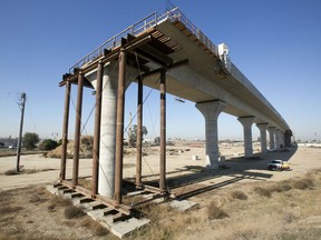 FILE - This Dec. 6, 2017, file photo shows one of the elevated sections of the high-speed rail under construction in Fresno, Calif. California has sued to block the Trump administration from cancelling nearly $1 billion for the state's high-speed rail project. The lawsuit filed Tuesday, May 21, 2019 comes after the administration revoked the funding last week. Gov. Gavin Newsom has called the move illegal and says it's political retribution for California's resistance to President Donald Trump's immigration policies.