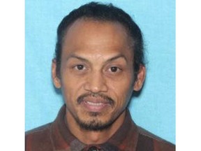 This undated booking photo provided by the Idaho State Police shows Jonathan Llana, 45. A search was underway Thursday, May 23, 2019 in southern Idaho for Llana, suspected of shooting and killing a motorist on a Utah highway, Idaho State Police said in a statement. (Idaho State Police via AP)