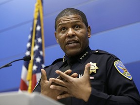 FILE - In this May 21, 2019, file photo, San Francisco Police Chief William Scott answers questions during a news conference in San Francisco. Scott is apologizing for raiding a freelance journalist's home and office to find out who leaked a police report into the unexpected death of the city's former public defender. Scott told the San Francisco Chronicle on Friday, May 24, 2019, the searches were probably illegal and said, "I'm sorry that this happened."