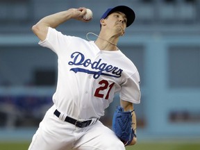 Los Angeles Dodgers starting pitcher Walker Buehler throws to a New York Mets batter during the first inning of a baseball game Wednesday, May 29, 2019, in Los Angeles.