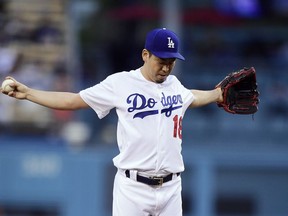 Los Angeles Dodgers starting pitcher Kenta Maeda, of Japan, gets set to pitch during the first inning of a baseball game against the San Diego Padres Wednesday, May 15, 2019, in Los Angeles.