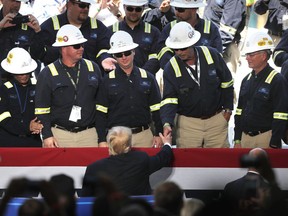 President Donald Trump shakes hands with workers after speaking at the Cameron LNG Export Terminal in Hackberry, La., Tuesday, May 14, 2019.