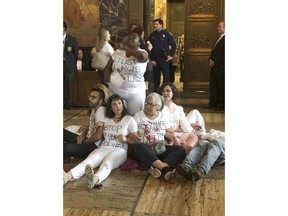 Abortion rights supporters protest outside the Louisiana House chamber, objecting to the advancement of a bill that would ban abortion when a fetal heartbeat is detected, on Wednesday, May 15, 2019, in Baton Rouge, La.