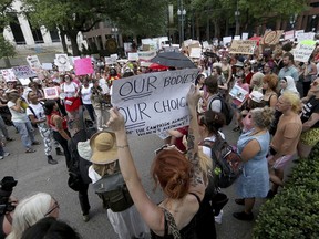 Hundreds of pro-choice supporters block Poydras Street outside One Shell Square to protest anti-abortion legislation during a Just Laws or Outlaws: Take to the Streets event organized by New Orleans Abortion Fund, Women With a Vision, the New Orleans Peoples' Assembly, and BYP 100 on Wednesday, May 22, 2019.