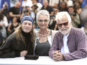 Actor Leon Vitali, from left, Katharina Kubrick and producer Jan Harlan pose for photographers at the photo call for the film 'The Shining' at the 72nd international film festival, Cannes, southern France, Thursday, May 16, 2019.