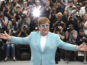 Singer Elton John poses for photographers at the photo call for the film 'Rocketman' at the 72nd international film festival, Cannes, southern France, Thursday, May 16, 2019.