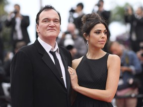 Film director Quentin Tarantino and his wife Daniela Pick pose for photographers upon arrival at the premiere of the film 'The Wild Goose Lake' at the 72nd international film festival, Cannes, southern France, Saturday, May 18, 2019.