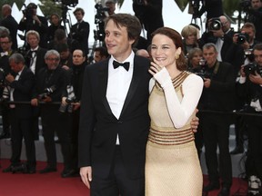 Actors August Diehl, left, and Valerie Pachner pose for photographers upon arrival at the premiere of the film 'A Hidden Life' at the 72nd international film festival, Cannes, southern France, Sunday, May 19, 2019.