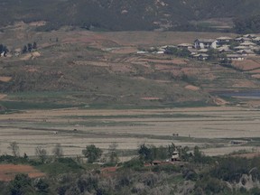 In this May 6, 2019, photo, North Korea's Kaepoong town is seen behind a North Korean military guard post, bottom, from the unification observatory in Paju, South Korea.  North Korea says it is suffering its worst drought in nearly four decades amid concern about a food crisis in the country. The official Korean Central News Agency said Wednesday that an average of 54.4 millimeters (2.1 inches) of rain fell throughout the country in the first five months of this year, the lowest level since 1982.
