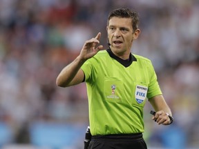 FILE - In this Sunday, June 24, 2018 file photo, referee Gianluca Rocchi from Italy directs the game during the group H match between Japan and Senegal at the 2018 soccer World Cup at the Yekaterinburg Arena in Yekaterinburg , Russia. UEFA says on Monday, May 13, 2019 it picked Italian referee Gianluca Rocchi for the all-English Europa League final between Arsenal and Chelsea. The 45-year-old Rocchi has handled three games involving English teams this season in the Champions League and all failed to win.