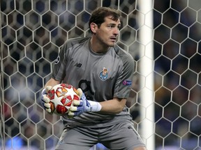 FILE - In this Wednesday, April 17, 2019 file photo, Porto goalkeeper Iker Casillas holds the ball during their Champions League quarterfinals, 2nd leg, soccer match against Liverpool at the Dragao stadium in Porto, Portugal. Veteran goalkeeper Iker Casillas has had a heart attack but is out of danger, Porto said Wednesday, May 1. The Portuguese club said Casillas fell ill during a practice session and remains hospitalized, but the "heart condition has been resolved."