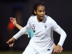 FILE - In this Thursday, Feb. 28, 2019 file photo, France's Wendie Renard controls the ball during their women's international friendly soccer match against Germany at Francis-le-Basser stadium in Laval, western France. With an experienced side featuring seven players from the Lyon side which recently won the Champions League for the fourth straight year, host France will be among the favorites for the Women's World Cup. Among the seven Lyon players coach Corinne Diacre can count on are imposing center half Wendie Renard and midfield schemer Amandine Henry, who will captain France.