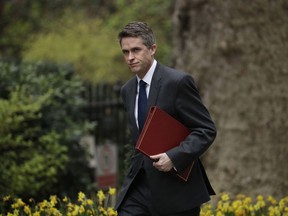 FILE - In this Tuesday, April 2, 2019 file photo, Britain's Defence Secretary Gavin Williamson arrives for a cabinet meeting in 10 Downing Street, London. British Defense Secretary Gavin Williamson has been fired Wednesday, May 1 after an investigation into leaks from a secret government meeting about Chinese telecoms firm Huawei. Prime Minister Theresa May's office says May has "lost confidence" in Williamson.