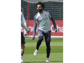 Liverpool's Mohamed Salah takes part in a training session at the Liverpool soccer team media open day, in Liverpool, England, Tuesday, May 28, 2019, ahead of their Champions League Final soccer match against Tottenham on Saturday in Madrid.