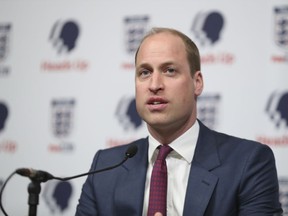 Britain's Prince William, President of the Football Association, right, speaks at the launch of a new mental health campaign at Wembley Stadium, London, Wednesday May 15, 2019.