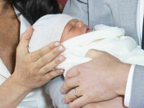 Britain's Prince Harry and Meghan, Duchess of Sussex, during a photocall with their newborn son, in St George's Hall at Windsor Castle, Windsor, south England, Wednesday May 8, 2019. Baby Sussex was born Monday at 5:26 a.m. (0426 GMT; 12:26 a.m. EDT) at an as-yet-undisclosed location. An overjoyed Harry said he and Meghan are "thinking" about names.