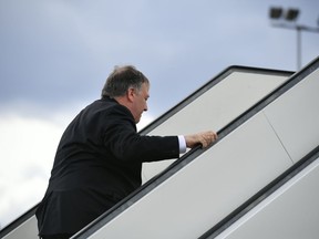 US Secretary of State Mike Pompeo boards a plane at Rovaniemi Airport in Rovaniemi, Finland, after taking part in the 11th Ministerial Meeting of the Arctic Council, Tuesday May 7, 2019.