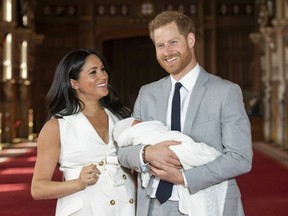 Britain's Prince Harry and Meghan, Duchess of Sussex, during a photocall with their newborn son, in St George's Hall at Windsor Castle, Windsor, south England, Wednesday May 8, 2019. Baby Sussex was born Monday at 5:26 a.m. (0426 GMT; 12:26 a.m. EDT) at an as-yet-undisclosed location. An overjoyed Harry said he and Meghan are "thinking" about names.