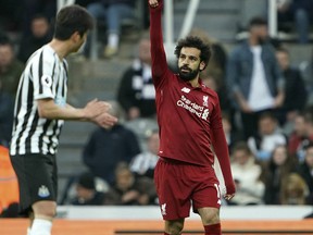 Liverpool's Mohamed Salah celebrates scoring against Newcastle United during the English Premier League soccer match at St James' Park, Newcastle, England, Saturday May 4, 2019.