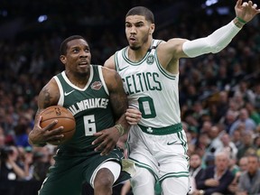 Milwaukee Bucks' Eric Bledsoe (6) drives as Boston Celtics' Jayson Tatum (0) defends during the first half of Game 3 of a second round NBA basketball playoff series in Boston, Friday, May 3, 2019.