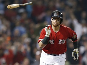 Boston Red Sox's Christian Vazquez runs on his RBI single during the sixth inning of the team's baseball game against the Houston Astros in Boston, Friday, May 17, 2019.