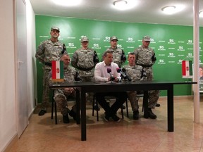Laszlo Toroczkai, first row center, head of Hungary's far-right Our Homeland Movement, announces the formation of the National Legion, a "self-defense group" created in the spirit of the Hungarian Guard, which was disbanded by the courts in 2009 in Budapest, Hungary, Tuesday, May 14, 2019. The group's main activities will include "guarding of traditions" and teaching basic military skills.