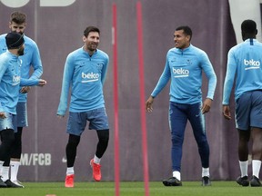 FC Barcelona's Lionel Messi, center left takes part in a training session with teammates at the Sports Center FC Barcelona Joan Gamper in Sant Joan Despi, Spain, Friday, May 24, 2019. FC Barcelona will play against Valencia in the Spanish Copa del Rey soccer match final on Saturday.