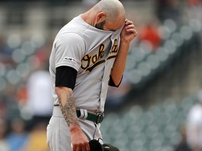 Oakland Athletics starting pitcher Mike Fiers wipes his forehead during the first inning of a baseball game against the Detroit Tigers, Sunday, May 19, 2019, in Detroit.