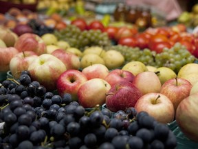 FILE - In this Sept. 18, 2014 file photo, produce is displayed for sale at a farmers market in Kalamazoo, Mich. A study released on Wednesday, May 15, 2019 suggests that trimming dietary fat and eating more fruits and vegetables may lower a woman's risk of dying of breast cancer.