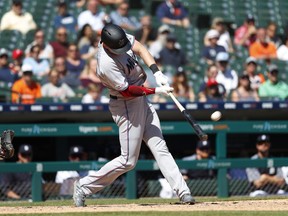 Miami Marlins' Garrett Cooper hits a grand slam in the ninth inning of a baseball game against the Detroit Tigers in Detroit, Thursday, May 23, 2019.