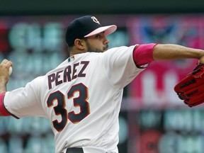 Minnesota Twins pitcher Martin Perez throws against the Detroit Tigers in the first inning of a baseball game Sunday, May 12, 2019, in Minneapolis.