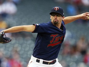 Minnesota Twins pitcher Devin Smeltzer, making his Major League debut, throws against the Milwaukee Brewers in the first inning of a baseball game, Tuesday, May 28, 2019, in Minneapolis.