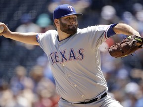 Texas Rangers starting pitcher Lance Lynn throws during the first inning of a baseball game against the Kansas City Royals, Thursday, May 16, 2019, in Kansas City, Mo.