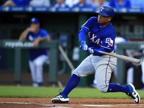 Texas Rangers designated hitter Willie Calhoun hits a two-run home run off Kansas City Royals starting pitcher Jorge Lopez during the first inning of a baseball game at Kauffman Stadium in Kansas City, Mo., Wednesday, May 15, 2019.