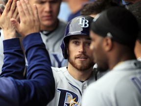 Tampa Bay Rays' Brandon Lowe is congratulated by teammates after hitting a two-run home run during the ninth inning of a baseball game against the Kansas City Royals at Kauffman Stadium in Kansas City, Mo., Thursday, May 2, 2019. The Rays defeated the Royals 3-1.