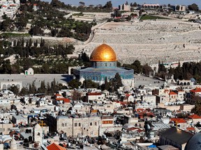 A picture taken on March 14, 2018 shows the Dome of the Rock which is situated in the Al-Aqsa mosque compound, with part of Jerusalem's Old City and the Mount of Olives .