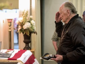 A veteran pays his respects to Army Pvt. William A. Boegli during a funeral service on Saturday, May 25, 2019, in Bozeman, Mont.