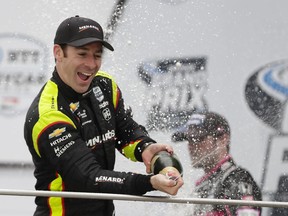 Simon Pagenaud, of France, celebrates after winning the Indy GP IndyCar auto race at Indianapolis Motor Speedway, Saturday, May 11, 2019, in Indianapolis.