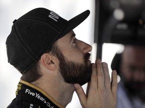 James Hinchcliffe, of Canada, looks at screens in his pit box during practice for the Indianapolis 500 IndyCar auto race at Indianapolis Motor Speedway, Friday, May 17, 2019 in Indianapolis.