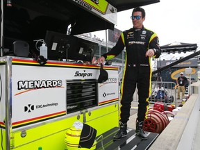 Simon Pagenaud, of France, stand on the pit wall following the final practice session for the Indianapolis 500 IndyCar auto race at Indianapolis Motor Speedway, Friday, May 24, 2019, in Indianapolis.