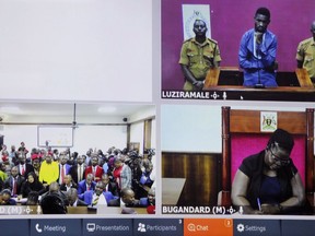 Ugandan pop star and opposition figure Bobi Wine, above-right, whose real name is Kyagulanyi Ssentamu, appears for his bail application via a video link from prison, on a television screen also showing the chief magistrate, below-right, and his supporters, left, in a court in Kampala, Uganda Thursday, May 2, 2019. Wine was freed on bail Thursday after spending three nights in a maximum-security prison after being charged with disobeying statutory authority and facing trial over staging a street protest in July against a tax on social media.