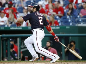 Washington Nationals' Adam Eaton watches his solo home run in the first inning of a baseball game against the Miami Marlins, Friday, May 24, 2019, in Washington.