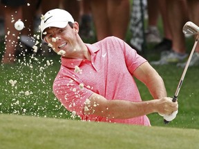 Rory McIlroy, of Northern Ireland, hits from a sand trap on the first hole during the final round of the Wells Fargo Championship golf tournament at Quail Hollow Club in Charlotte, N.C., Sunday, May 5, 2019.