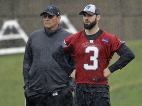 Carolina Panthers rookie quarterback Will Grier (3) stands with head coach Ron Rivera, left, during the NFL football team's rookie camp in Charlotte, N.C., Friday, May 10, 2019.