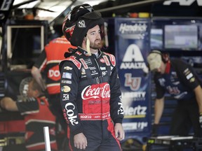 Austin Dillon waits as he crew prepares his car before practice for Sunday's NASCAR Cup Series auto race at Charlotte Motor Speedway in Concord, N.C., Saturday, May 25, 2019.