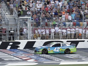 Kyle Larson takes the checkered flag to win the final segment of the NASCAR All-Star Open auto race at Charlotte Motor Speedway in Concord, N.C., Saturday, May 18, 2019. Larsen moved on to the All-Star Race with the win.