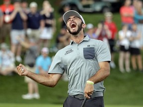 Max Homa celebrates after winning the Wells Fargo Championship golf tournament at Quail Hollow Club in Charlotte, N.C., Sunday, May 5, 2019.